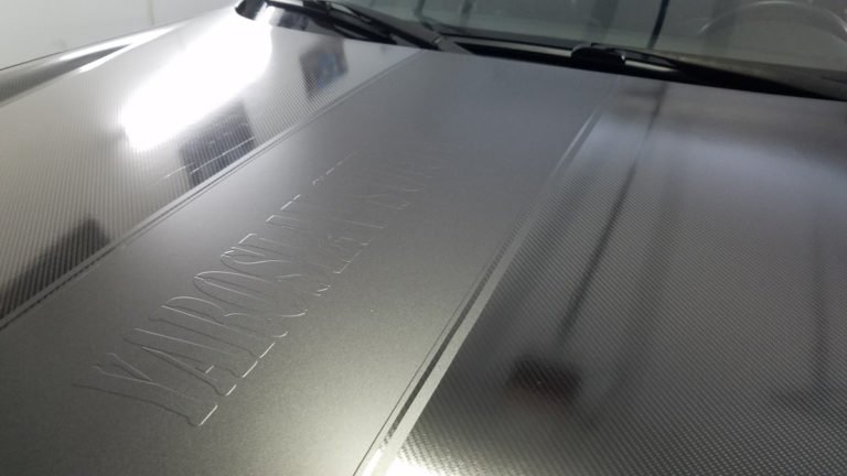 Read more about the article Racing stripes, vehicle stripes , graphics installation and Custom Hood Wrap