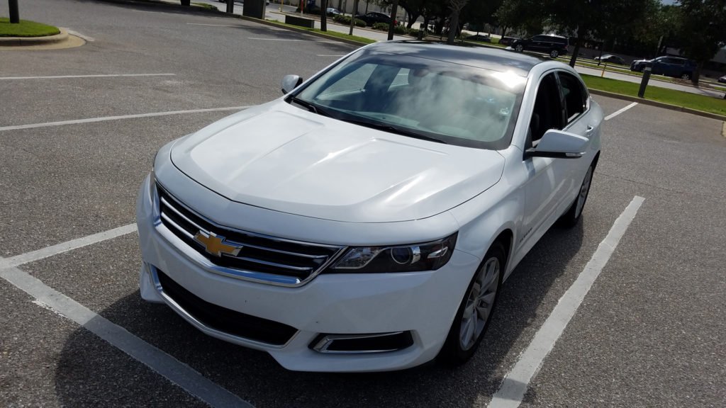 Matte black Chevy Roof Wrap by 10-4 Wrapsroof wrap installed on a Chevy vehicle in Destin
