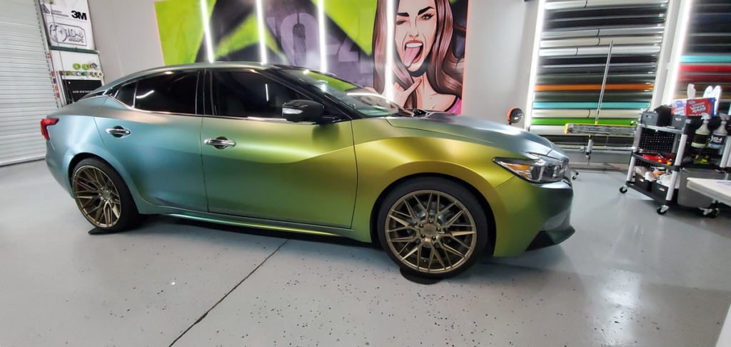 Nissan Maxima with custom vinyl Nissan Maxima Wrap - Custom Vinyl Car Wrap for Stylish Protectioncar wrap in matte black finish.