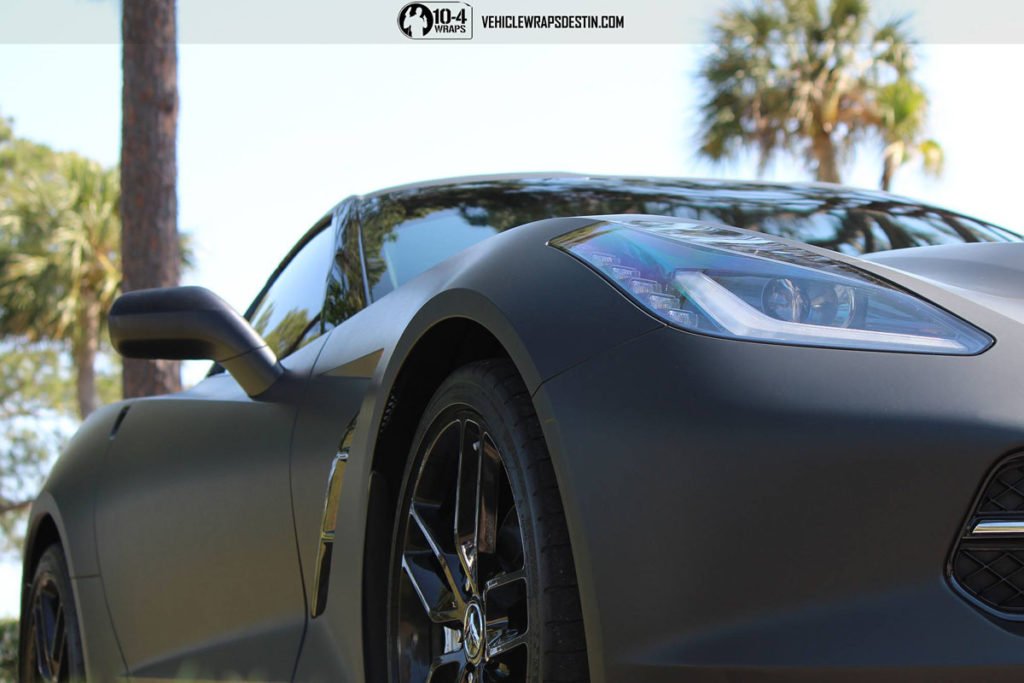 Side view of Corvette C7 matte blaSide Profile of Matte Black Corvette C7 with Custom Accentsck wrap in Destin