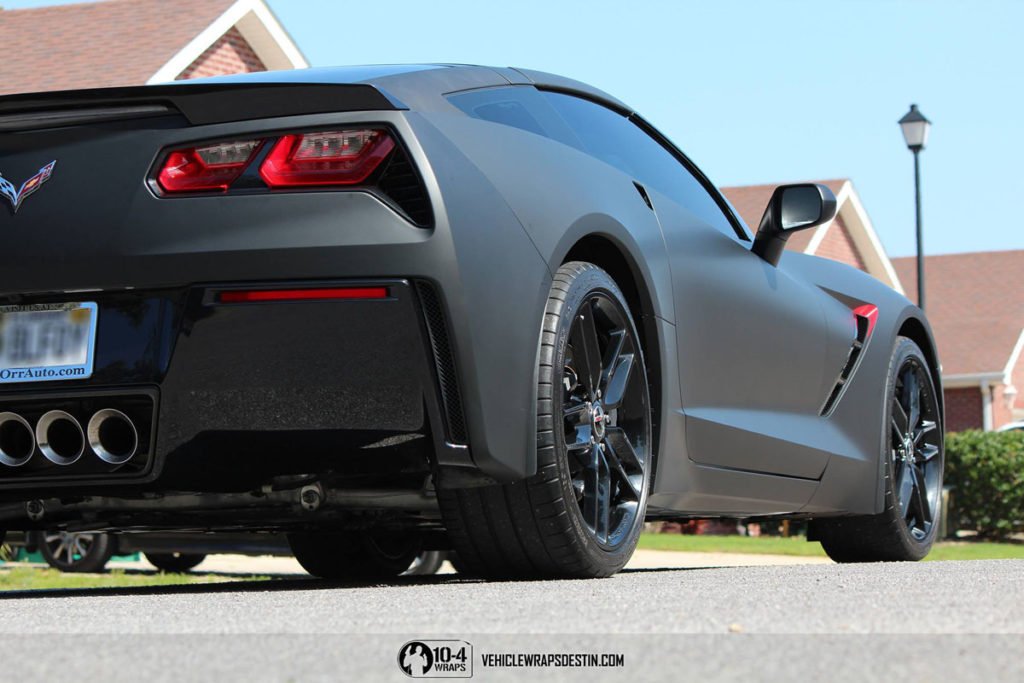 Side view of Corvette C7 matte blaSide Profile of Matte Black Corvette C7 with Custom Accentsck wrap in Destin