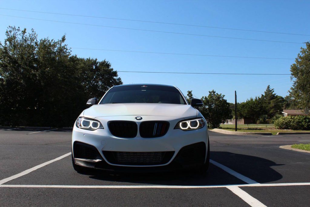 Carbon fiber spoiler and rear diffusCarbon Fiber Add-Ons for Wrapped BMW M235 – 10-4 Wrapser on a wrapped BMW M235 in Panama City, FL.