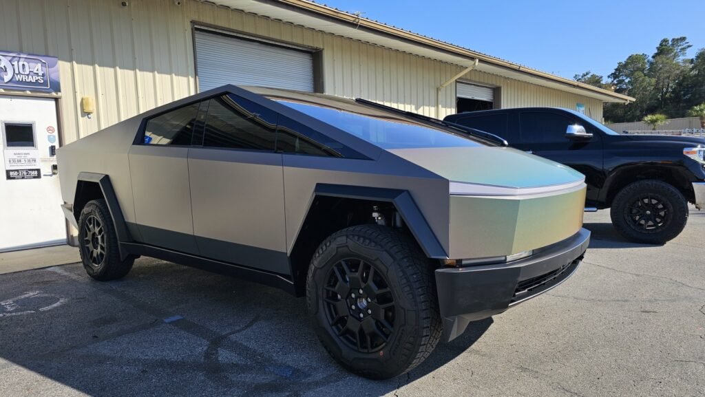 Futuristic Tesla Cybertruck parked outside